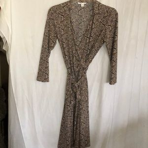 Tan wrap dress with geometric patterns